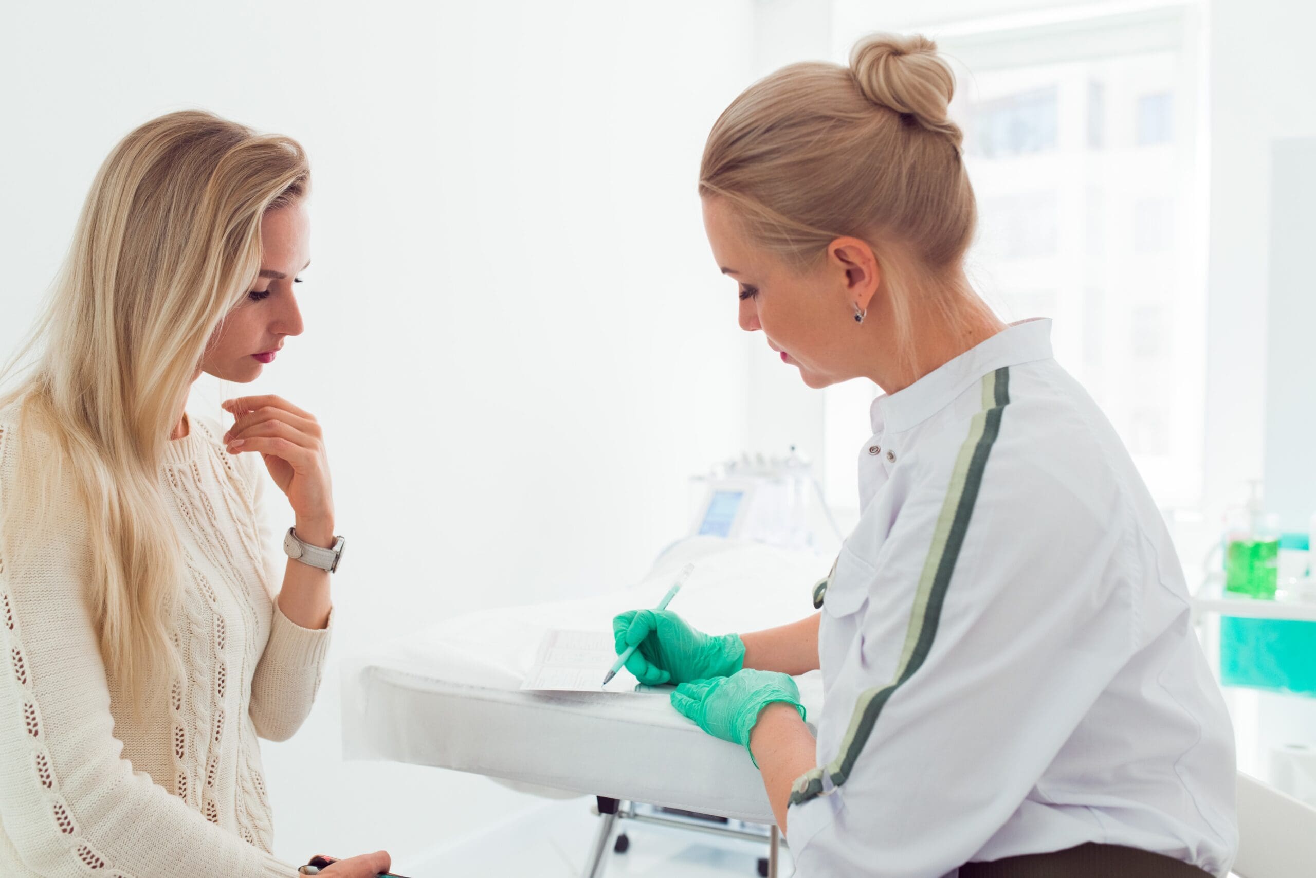 A qualified injector consulting with a patient about Botox and filler treatments highlighting the importance of communication and personalized care in cosmetic procedures | Passion Beauty Academy A qualified injector consulting with a patient about Botox and filler treatments, emphasizing the importance of clear communication and personalized care during the consultation process.